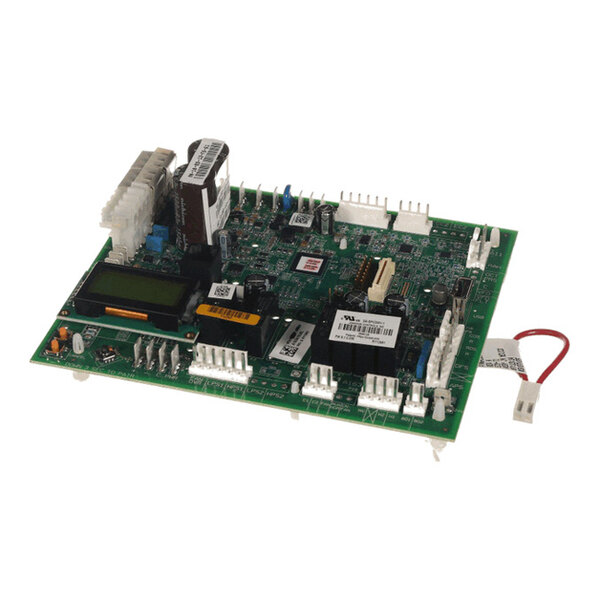 A green electronic circuit board with various components, connectors, and a small attached cable visible.