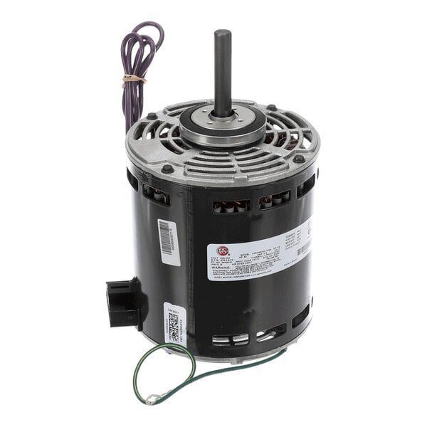 A cylindrical electric motor with a central shaft, ventilation openings, attached wires, and identification labels.