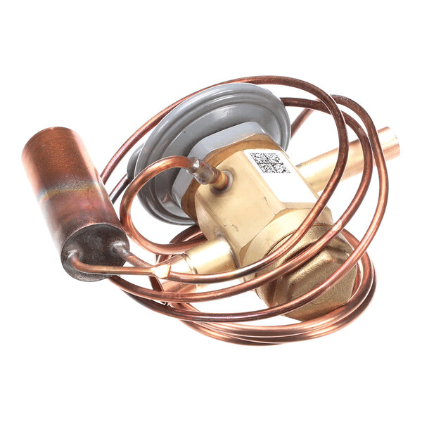 A brass and copper valve assembly with coiled copper tubing and a cylindrical component attached.