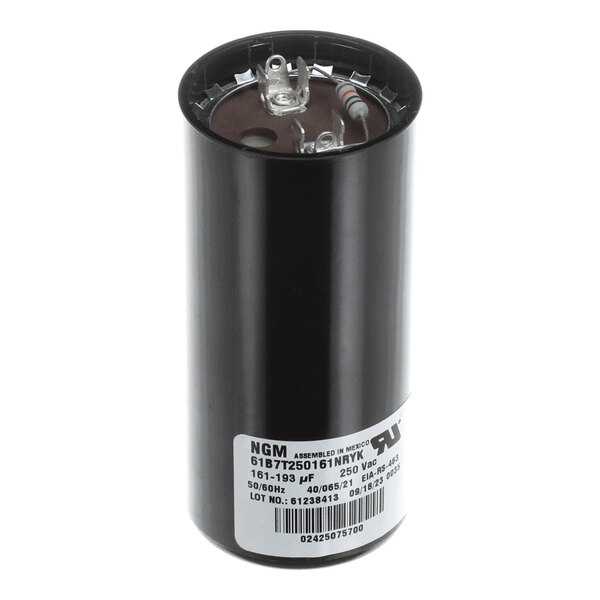 A cylindrical black capacitor with two metal terminals on top and a white label with technical specifications on the side.
