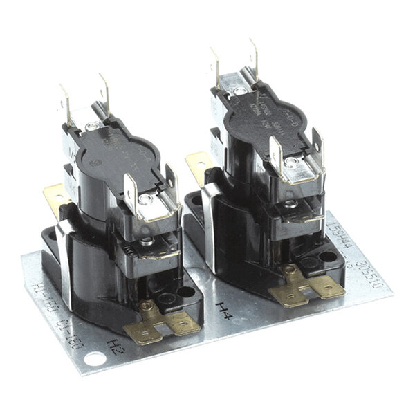 Two black and metallic electrical components mounted on a rectangular metal plate with multiple terminals and connectors visible.