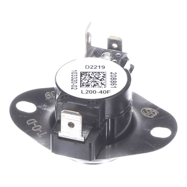 A round, black and silver electronic component with two metal terminals and a white label featuring a QR code and alphanumeric text, mounted on a flat base with two screw holes.