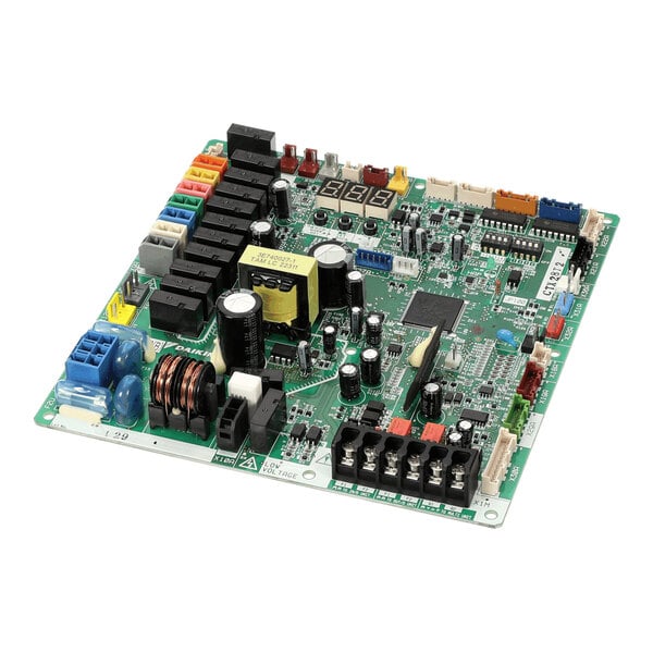A green printed circuit board with various electronic components, connectors, and relays mounted on its surface.