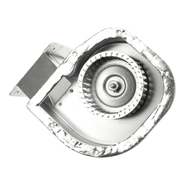 A metallic blower assembly with a circular fan encased in a housing, viewed from above.