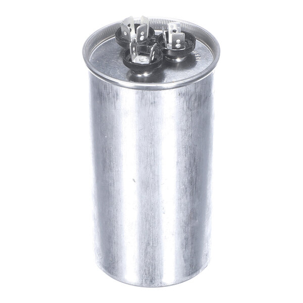 A cylindrical metallic component with three electrical terminals on the top.