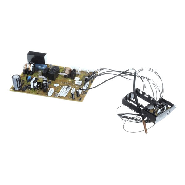 A printed circuit board assembly with various electronic components and attached wires leading to a separate black plastic module.
