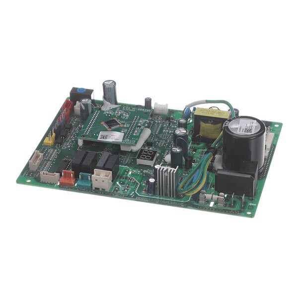 A green electronic circuit board with various components including capacitors, connectors, relays, and heat sinks mounted on it.