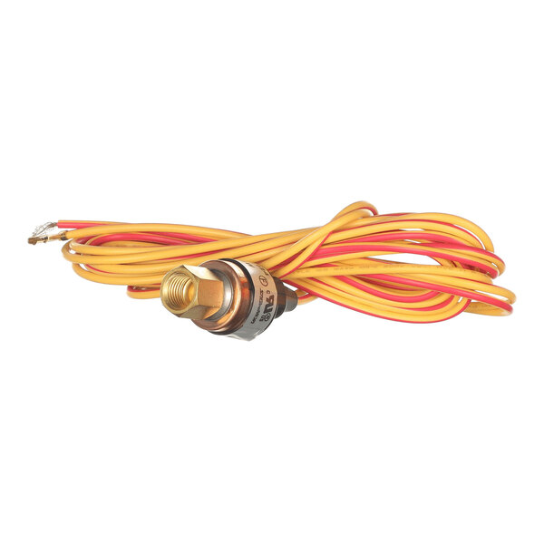 A metal pressure switch with attached yellow and red electrical wires coiled around it.