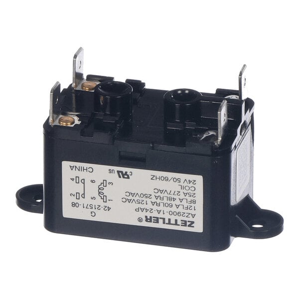 A black rectangular electrical relay with metal terminals and a white label displaying technical specifications.