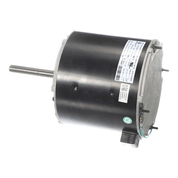 A cylindrical electric motor with a protruding shaft and a label containing technical specifications.
