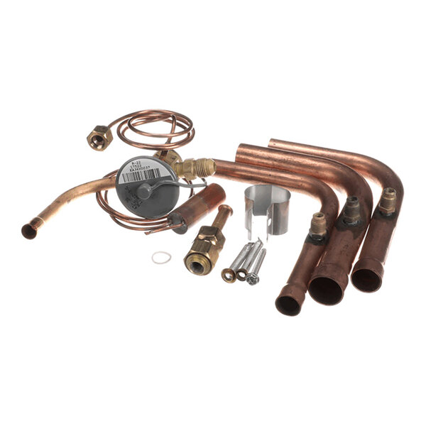 A set of copper pipes, fittings, a coiled tube, a valve, and various small metal components arranged on a white background.
