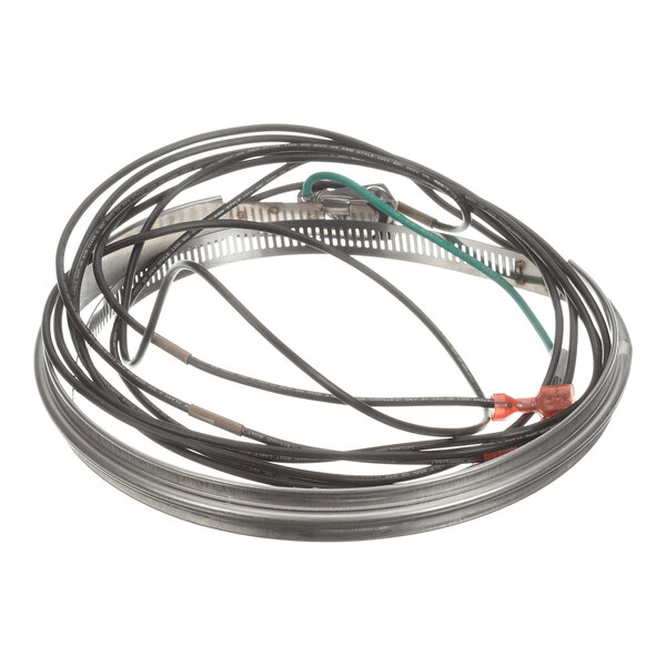A coiled black electrical cable with connectors and a metal clamp, arranged in a circular shape.