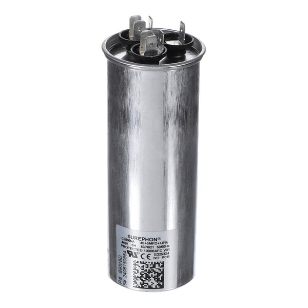 A cylindrical metallic component with three electrical terminals on top and a label with technical specifications on the side.