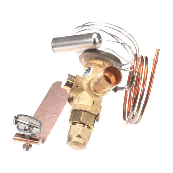 A brass valve assembly with copper tubing and a coiled sensor line, featuring various fittings and a mounting bracket.
