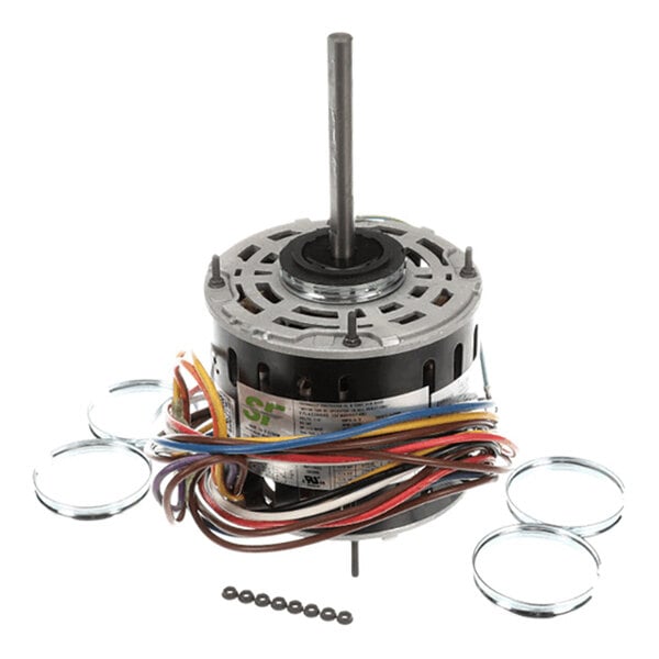 An electric motor with a central shaft, multiple colored wires, and several metal rings and small black components arranged around it.