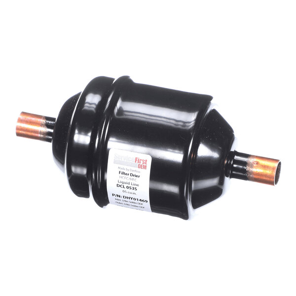 A black cylindrical filter drier with copper pipe connections on both ends and a label on the side.