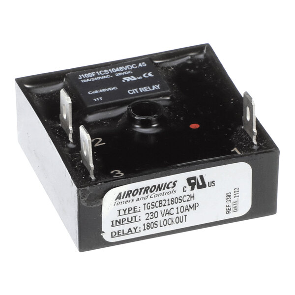 A black rectangular electronic component with four metal prongs and a label indicating it is an Airotronics timer and control device, model TGSCB2180SC2H, with a 230 VAC 10 AMP input and an 180-second lockout delay.
