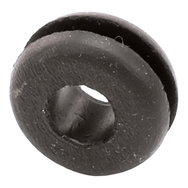 A close-up view of a black, round rubber-like grommet with a central hole and a groove around its circumference.