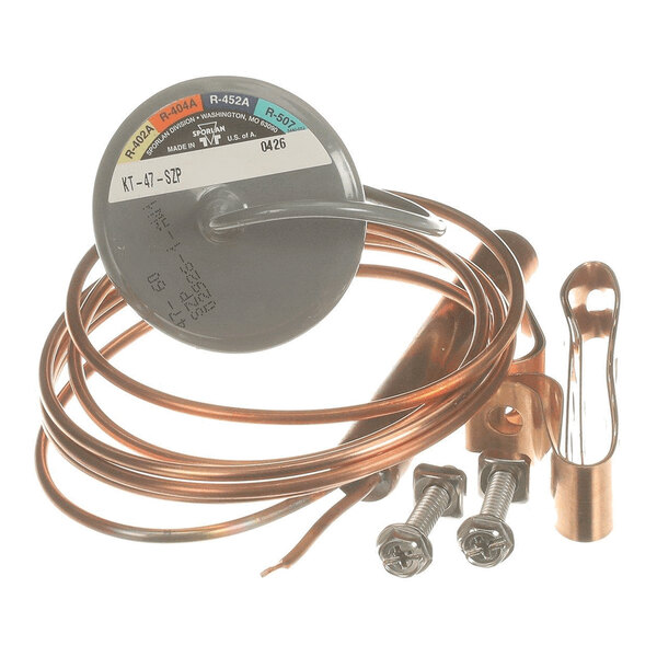 A coiled copper tube with a round metal component, a mounting bracket, and two screws.