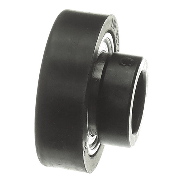 A black cylindrical mechanical component with a central hole, likely a bearing or roller.