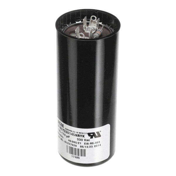 A cylindrical black electrical capacitor with metal terminals on top and a white label on the side.