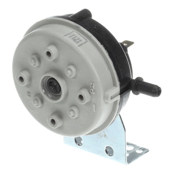 A round, gray and black air pressure control switch mounted on a metal bracket, with multiple ports and electrical connectors visible.