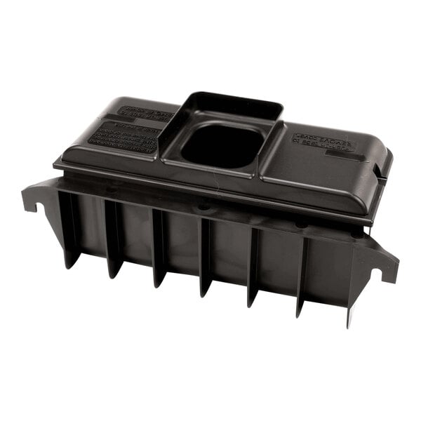 A black rectangular plastic component with vertical fins and a central square opening on the top surface.