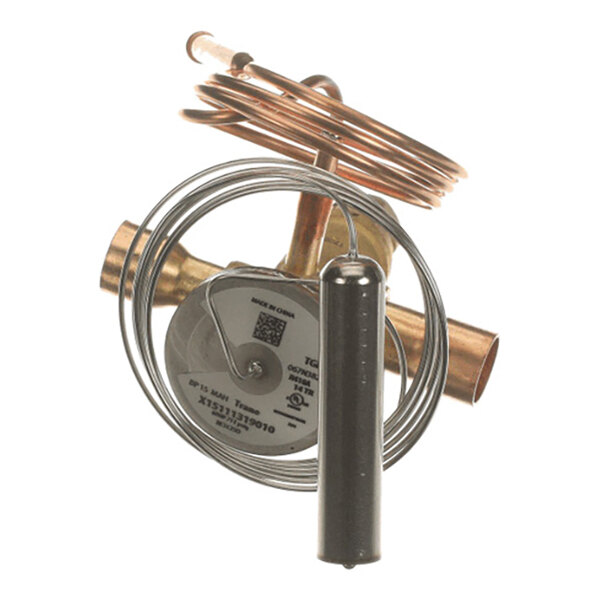 A metallic valve assembly with coiled copper tubing and a cylindrical component attached.