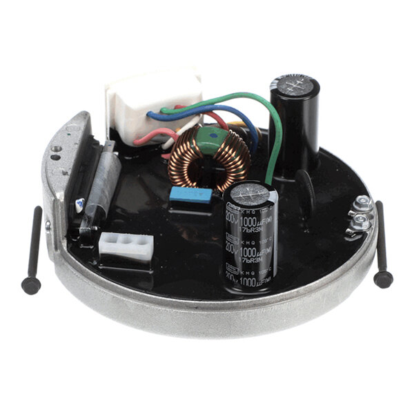 A round electronic circuit board with various components including capacitors, wires, and a copper coil mounted on it.