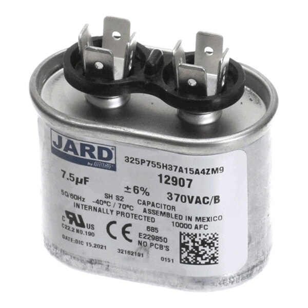 A metal can capacitor with dual terminals on top and a label displaying specifications such as 7.5µF, 370VAC, and manufacturer information.