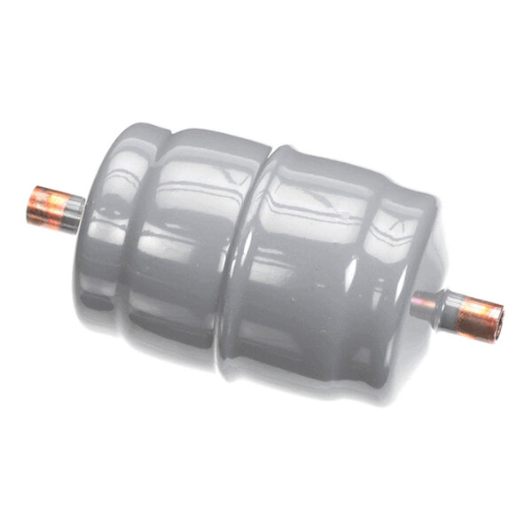 A cylindrical, gray metallic component with copper pipe fittings on both ends, likely used in HVAC or refrigeration systems.
