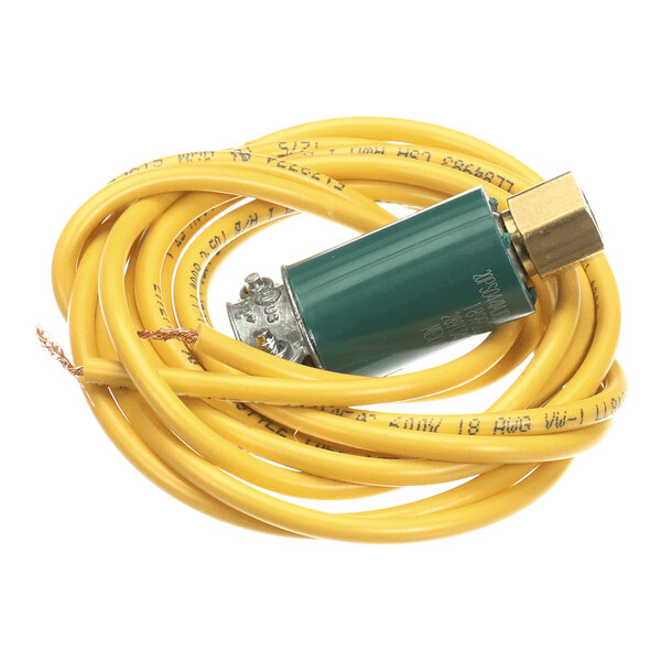 A green cylindrical component attached to a yellow electrical wire with exposed copper ends, coiled in a loop.