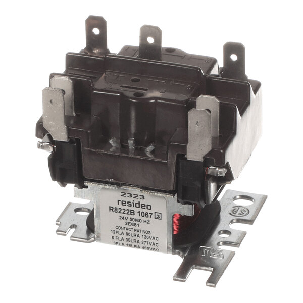 A close-up view of an electrical relay with multiple metal terminals and a labeled metal base.