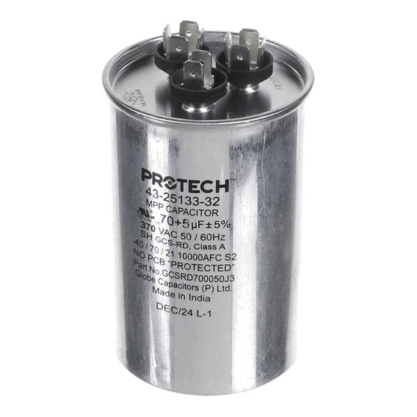 A cylindrical metallic capacitor with three sets of electrical terminals on top and printed technical specifications on the side.