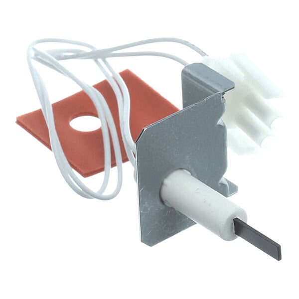 A metal and ceramic component with a black rectangular element, white wires, a white connector, and a red gasket.