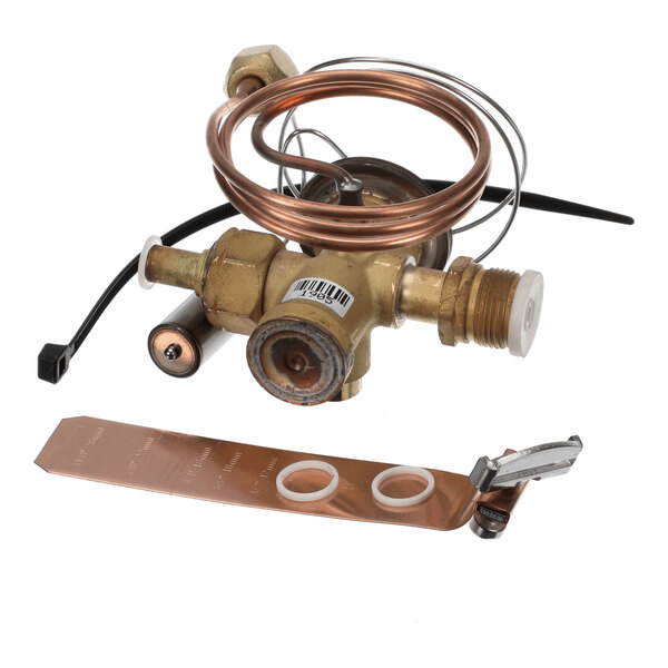 A brass valve assembly with coiled copper tubing, a copper strip, two white washers, and a small metal clamp, all placed on a white background.