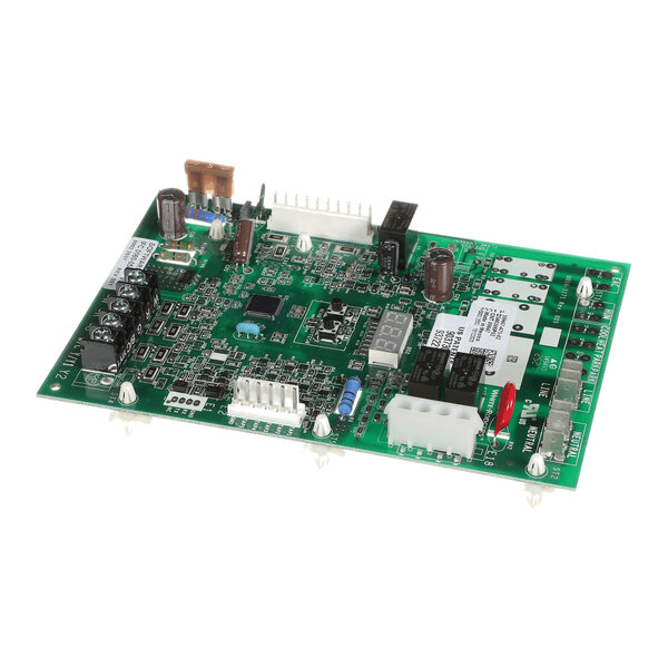 A green printed circuit board with various electronic components, connectors, and relays mounted on it.