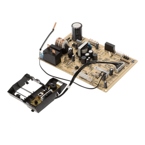 A printed circuit board with various electronic components and an attached black plastic component connected by wires.