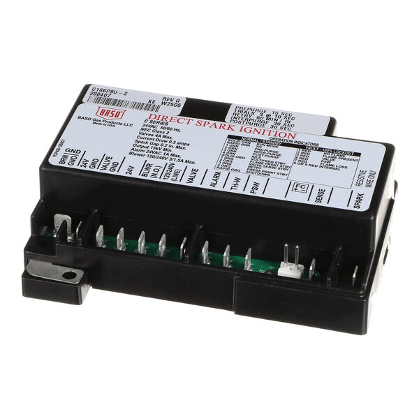 A rectangular electronic ignition control module with labeled terminals and a detailed instruction label on top.