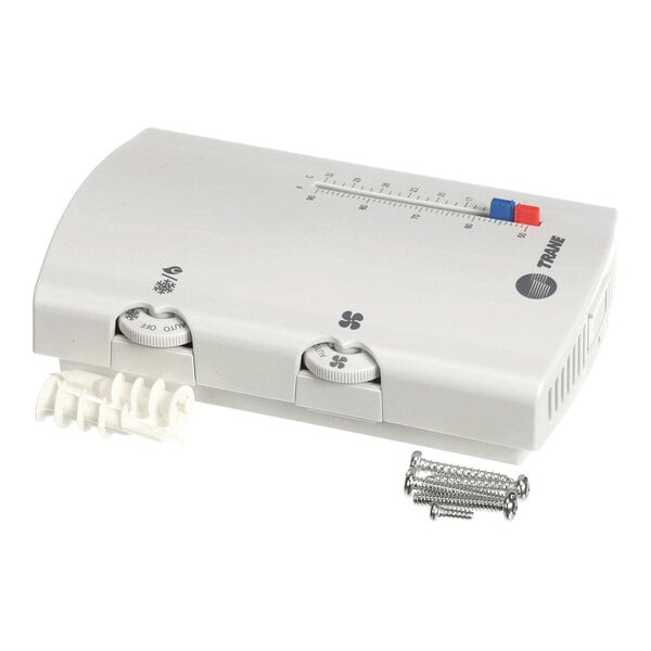A white rectangular device with two control dials, a temperature scale, and included mounting hardware (screws and wall anchors).