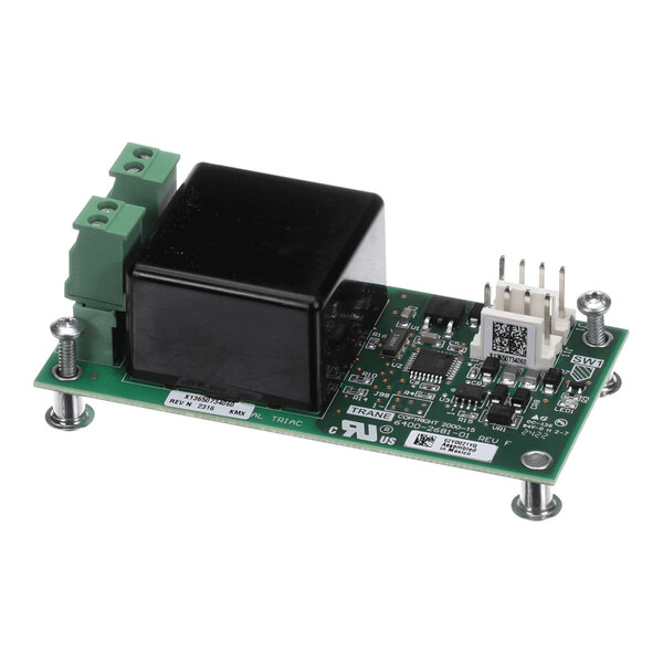 A green electronic circuit board with various components, including a large black rectangular component, green terminal blocks, white connectors, and mounted on four metal standoffs.