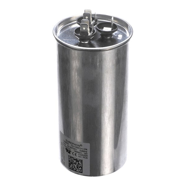 A cylindrical metallic component with two electrical terminals on top and a label with text and a QR code on the side.
