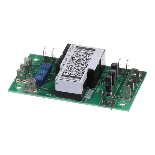 A green electronic control board featuring a large transformer, capacitors, terminal connectors, and blue potentiometers.