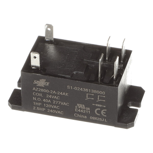 A black rectangular electrical relay with metal prongs and white printed specifications on its side.