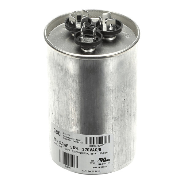A cylindrical metal component with three electrical terminals on top and a label with technical specifications on the side.