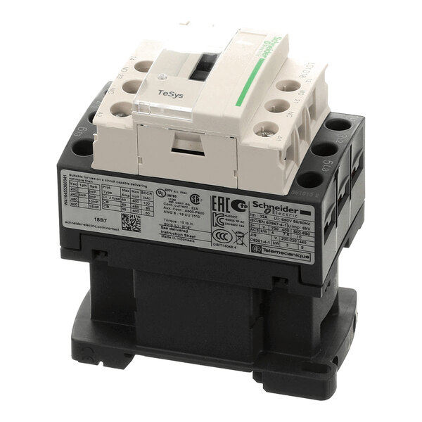 A three-pole electrical contactor with labeled terminals and a detailed specification label on the side.