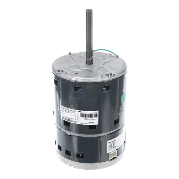 A cylindrical electric motor with a central shaft extending vertically from the top and several labels attached to its body.