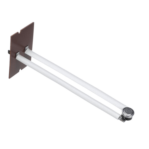 A device with two parallel white rods attached to a brown rectangular base, featuring a round metallic component at the end of the rods.