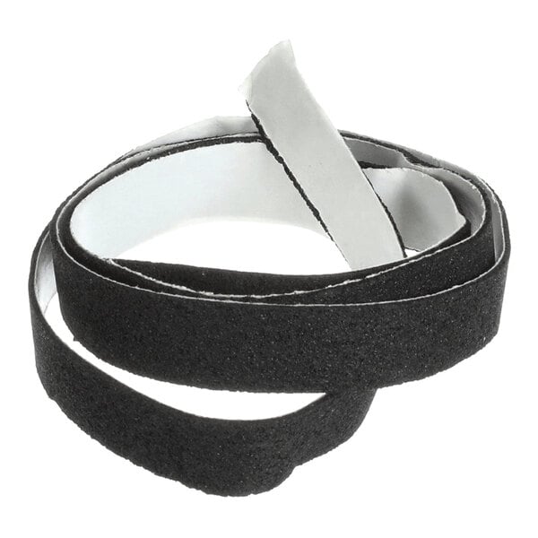 A coiled strip of black material with a textured surface and a peel-off adhesive backing.