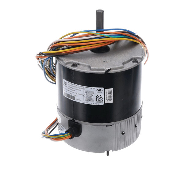 A cylindrical electric motor with a protruding shaft, multiple colored wires, and a label with technical specifications attached to its side.